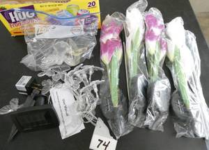 lot 74 image: Solar power - 4 groups of flowers, and a string of butterflies, all solar powered
