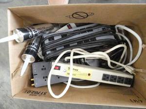 lot 83 image: Group of 5 electrical outlet strips and some roof cement