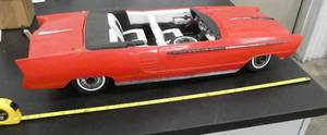 lot 94 image: Large 29 long Crusader 101 car - pretty cool looking but does have some issues, front grill is missing and the front tire is broke off and would need to be glued on, car is all plastic, appears to have been a remote control or maybe just lit up