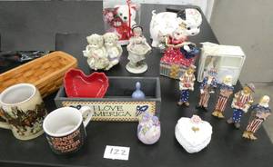 lot 122 image: Group of misc dcor items - musical clown and cherubs, piggy bank, coffee cup, baskets and bears, and a Budweiser mug