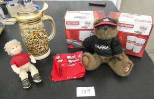 lot 129 image: Dale Earnhardt bear, Willie Nelson handkerchief, Craftsman pint glasses, and a Gold Rush stein