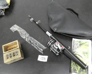 lot 133 image: Vintage Fishing Machine extending pole fishing rod and reel in carry bag, small jigging rod, old wood box with some weights