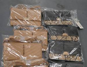lot 167 image: 12 new wallets - 6 tan and 6 black