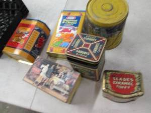 lot 95 image: vintage tins in a milk crate...