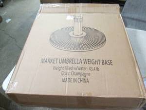 lot 132 image: market umbrella weight case...