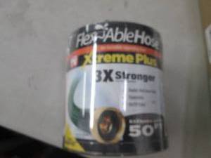 lot 232 image: flexible hose expandes up to 50ft...
