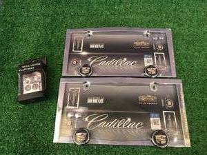 lot 80 image: New Cadillac License Plate Holders & Bolts