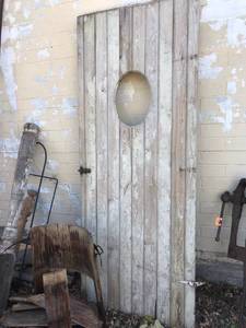 lot 348 image: Large Wood Door with Oval Opening