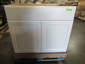 lot 209 image: Hampton Bay 36x34.5x24 in. Sink Base Kitchen Cabinet in Satin White - Scratch and Dent - Cracked LH Door, Damaged Bottom LH Corner.
