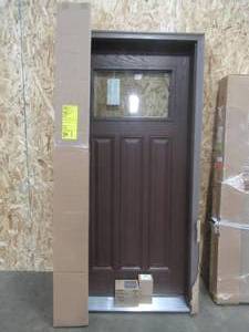 lot 147 image: 3 Panel Craftsman 36 x 80 Wood Exterior Door 14 Lite, In Moorish Teak With Brickmold. Double Bore - Never Installed.
