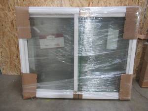 lot 186 image: SIMONTON CUSTOM 6500 Series Sliding Replacement Window in White Vinyl - 59 14 x 47 14 x 3 18 Wall, Dual Cams. No Screen - Never Installed.