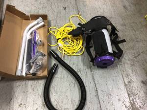 lot 106 image: Super QuarterVac 6 Qt. Commercial Backpack Vacuum Cleaner with Xover Multi-Surface Telescoping Wand Tool Kit by ProTeam Customer Returns See Pictures