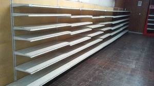 4 ft. Single Sided Retail Shelving. (8) End posts (9) and bases (9) and extra shelving.