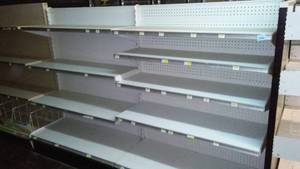 2 4 foot sections of retail display shelving - double sided.