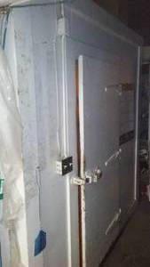 wood walk-in freezer refrigerator with contents.
