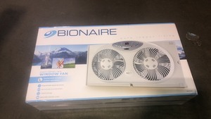 lot 35 image: Bionaire window fan with twin 8.5 in. Reversible airflow blades and remote control, white