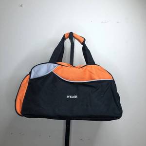 lot 34 image: Welsh Travel Well Orange Luggage Bag