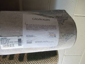 lot 7 image: Calvin Klein Ivory Blue Area Rug 710 x 9 10