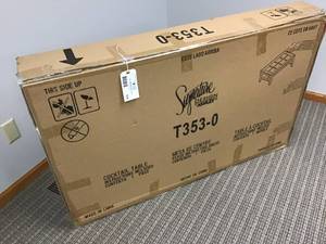 lot 515 image: Ashley Signature Toscana Coffee Table  Brand New