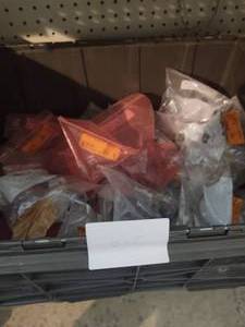 lot 225 image: 12 Tote full of 2 hole pipe straps...