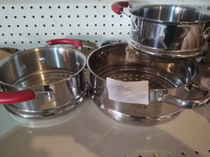 lot 28 image: 2 metal with red handles strainer w...