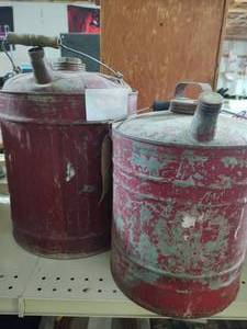 lot 137 image: 2 Vintage red metal fuel cans with ...