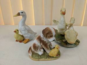 lot 38 image: Set of (3) Porcelain Figurines Swans and Dog