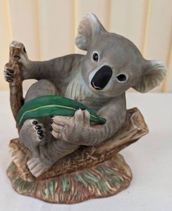 lot 170 image: Vintage Gray Koala Bear Laying wEucalyptus Leaves Porcelain Figurine