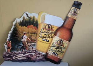 lot 294 image: Metal Leinenkugels Honey Weiss Sign