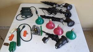 lot 314 image: Outdoor Lighting Lot - Flood Light Bulbs, Light Sensors, Stakes, Power Strip, 3-Prong Adapters