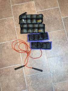 lot 81 image: Lot of Low Tech Exercise Equipment Two Pair of Weider AnkleWrist Weights and a Jump Rope