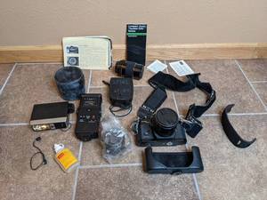 lot 51 image: Vintage Sears Auto TLS 35mm Camera with Many Accessories in Hard Sided Case