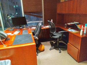 lot 783 image: U-Shaped Desk with Cabinets, 2 Office Chairs, Includes Office Supplies and Other Decor