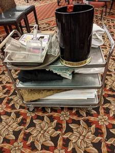 lot 670 image: Lot of Metal Utility Cart and Contents (Serving Pieces, Robe, Linens, and More)