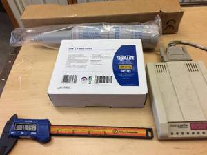 Tripp Lite USB 3.0 Mini Dock, Multi-Tech MT1932ZDXI-MMS Multi Modem System, and Fisher Scientific Digital Caliper