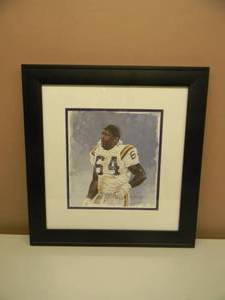 lot 16 image: Randall McDaniel HOF MINNESOTA VIKING Print by Artist Merv Corning -  Absolutely Great Piece - Professionally Framed - Approx 20 by 21 - SEE PICTURES