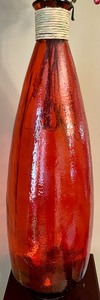 lot 10 image: Red Glass Vase with Faux Florals