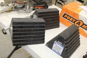 lot 23 image: Lot of (3) RMX Pyramid Shape Rubber Wheel Chock with Eye Bolt