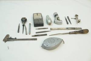 Calipers, nail punches, chalk line, stud finder and chisel