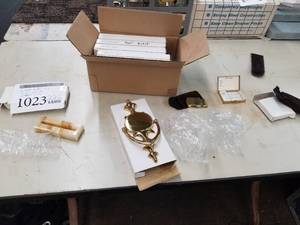 lot 1023 image: Lot of (7) Engravables  - Brass Door Knockers (x5), Business Card Holder (x1), Brass Pill Box (x1)