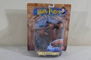 lot 49 image: Harry Potter Fluffy Action Figure