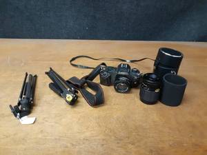 lot 1066 image: Canon T50 Camera, Extra Lens and Tripods