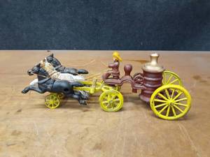 lot 1007 image: Cast Iron Fire Wagon pulled by horses - overall about 13 Long