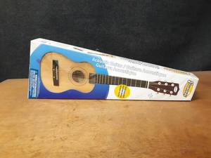 lot 1159 image: New in Box Wood Acoustic Guitar
