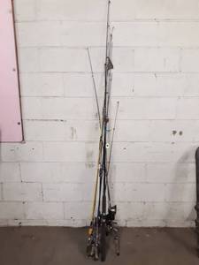 lot 1335 image: Lot of (12) Vintage and Modern Fishing Poles and Reels