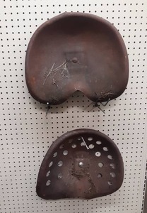 lot 1343 image: Pair of Antique Stamped Steel Tractor Seats