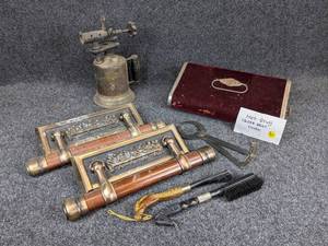 lot 1234 image: Antique Heater, Last Supper Casket Handles, Brass Torch, and More