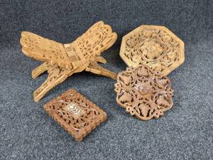 lot 1250 image: Carved Wood Cookbook Holder with Three Trivets