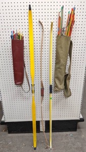 lot 1286 image: 3 Bows and Arrows in 2 Quivers - Bows measure 58 long, 53-12 long and 52-34 long