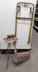 lot 1294 image: Bale Grabber, Iron 3-Legged Table, Chunk of Railroad Rail, and Mailbox